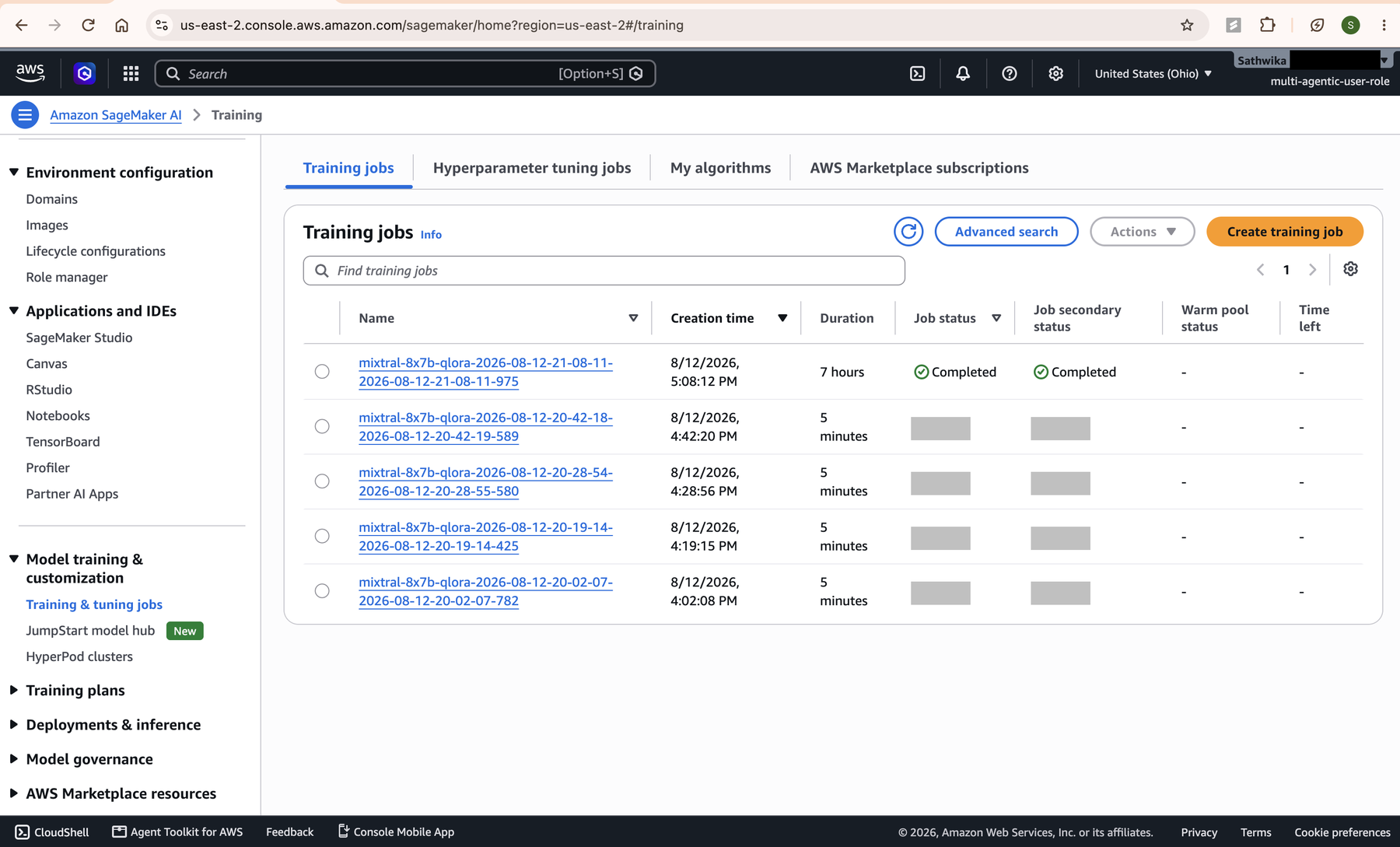 SageMaker training job list showing a completed QLoRA fine-tuning job.